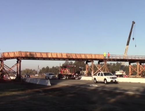 VIDEO: Conveyor bridge transporting materials over roadway on Cal. Route 180 project