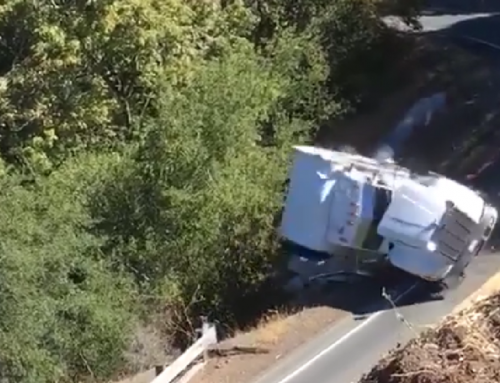 WATCH: Big rig driver tries to navigate steep curve, goes over embankment instead